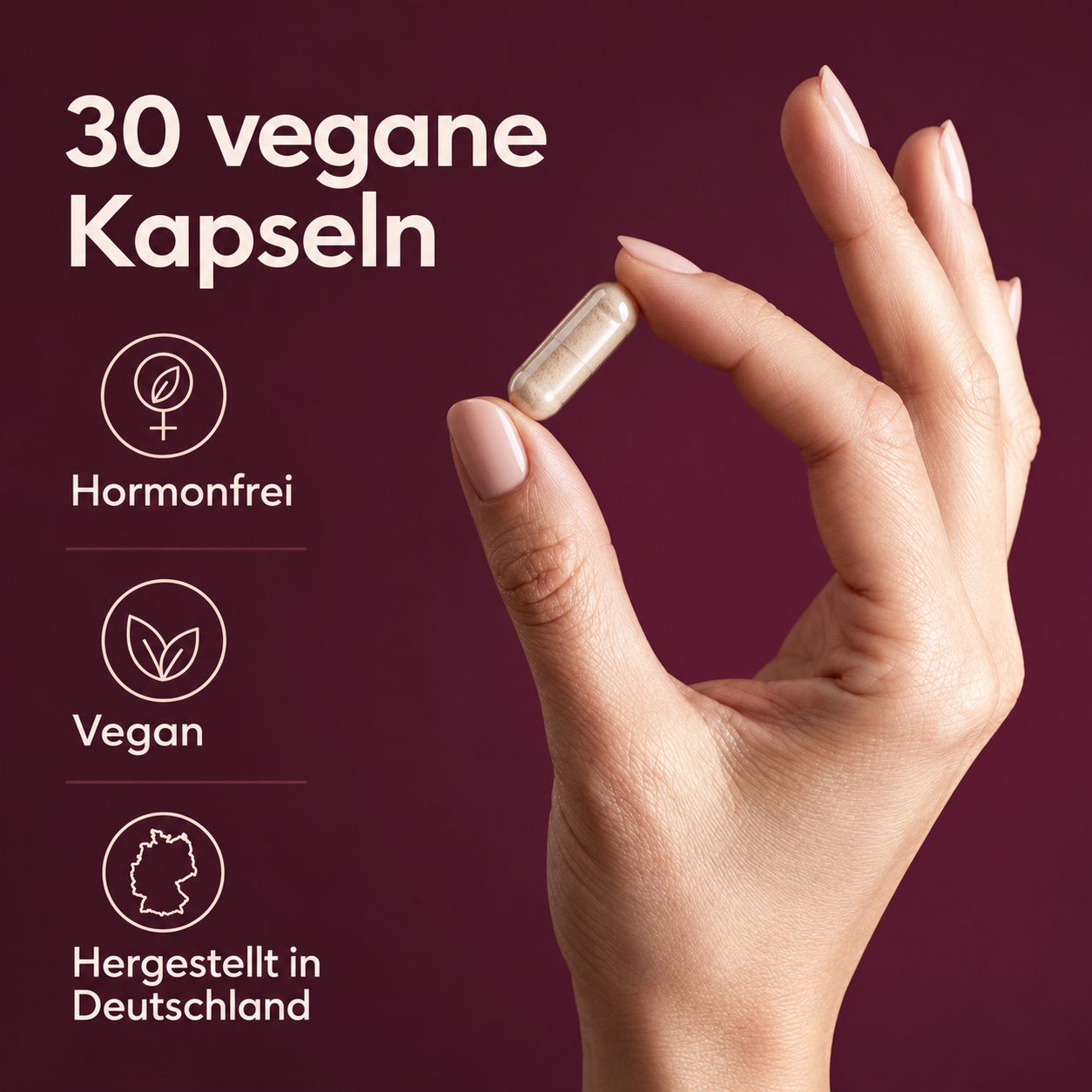 Eine Hand hält eine Kapsel vor tiefpflaumenfarbenem Hintergrund. 30 vegane Kapseln. Hormonfrei. Vegan. Hergestellt in Deutschland.